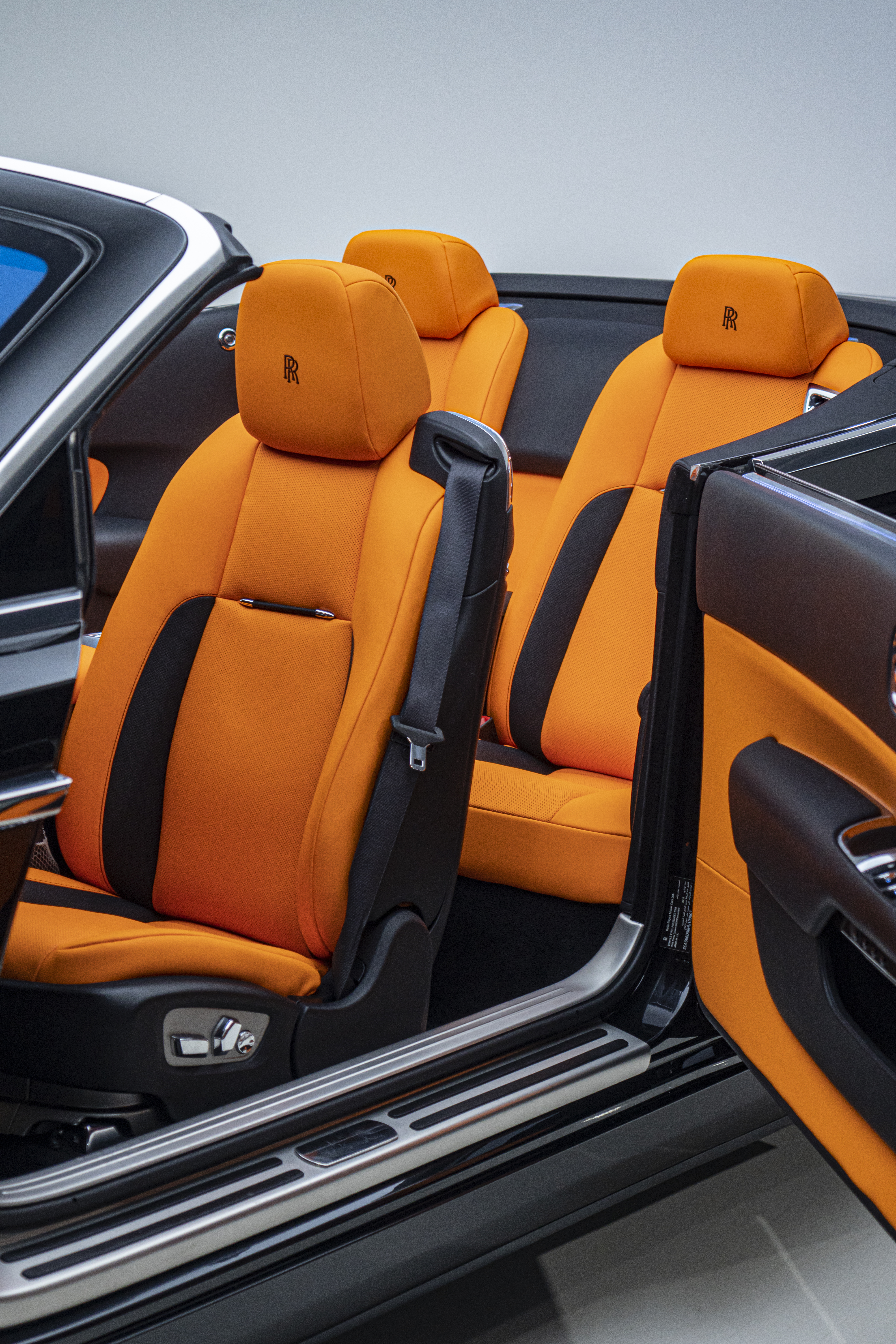 Professional auto detailing service being done on black car